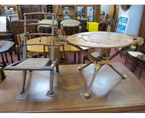 An African Hardwood Coffee Table, with folding tripod base having ethnic bust  terminals, 55cm high an Edwardian folding chai