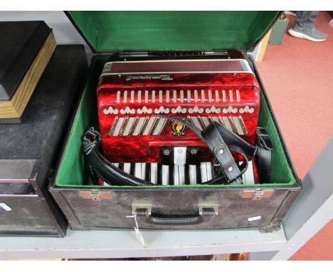 Parrot Accordion, with red marbelette covering in black carry case.