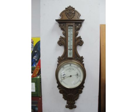 A Carved Oak Cased Wall Barometer, circa 1900.
