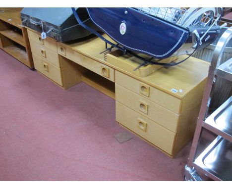 Light Wood Dressing Table, with a rectangular top, seven small drawers, on supports. 