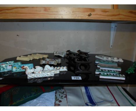 A mixed lot of ceramic knife rests. 