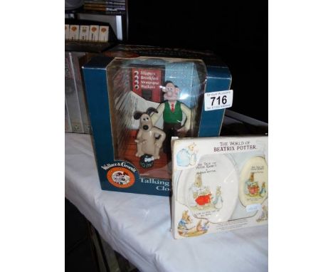 A boxed Wallace and Gromit, talking alarm clock and boxed Beatrix Potter soap and dish. 