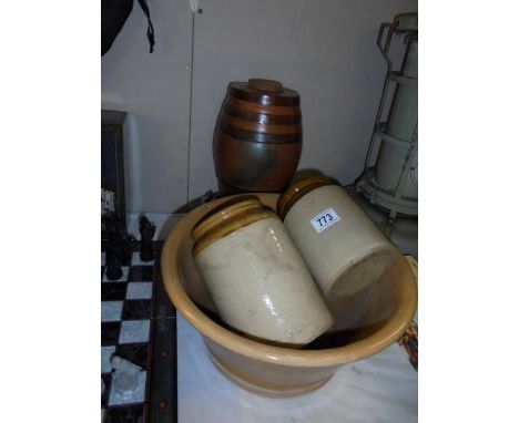 A stoneware Scotch barrel with brass tap and stoneware mixing bowl and 2 storage jars. 