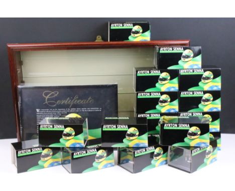 Boxed Pauls Model Art MiniChamps Ayrton Senna Racing Car Collection diecast cars (17 in total), together with a wooden displa