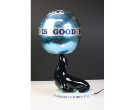 Advertising - A Carlton Ware 'Guinness Is Good For You' sealion lamp with revolving metal shade, black printed backstamp to u