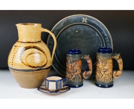 Group of ceramics to include Cricklade pottery jug, Quimper teacup and saucer two West German steins and a studio pottery mot