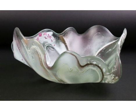 Contemporary studio art glass dish of organic shell-like form, with ribboned &amp; flecked decoration, indistinctly signed to