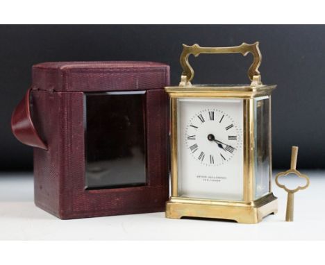A brass cased carriage clock with bevelled glass panels, maker marked for R &amp; Co of Paris and retail marked for Arthur Ja