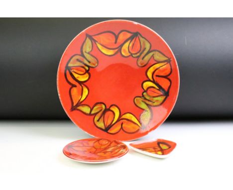 Poole Pottery 'Delphis' red ground shallow bowl (pattern no. 4, approx 26.5cm diameter), together with 2 x Poole Pottery Deph