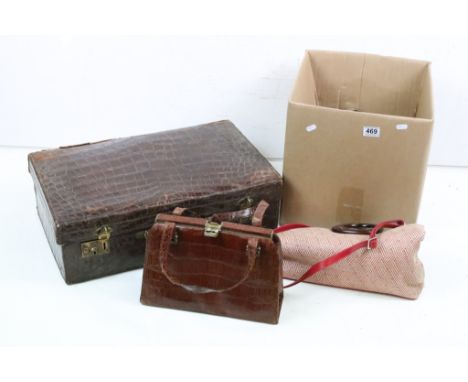 A collection of vintage handbags to include leather examples together with a suitcase. 