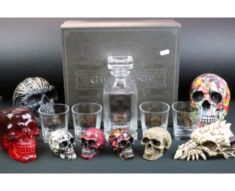 Game of Thrones set of four tumblers and decanter, within fitted presentation box; together with eight skull models, featurin