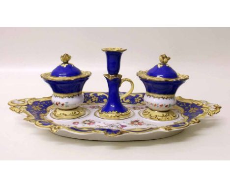 English porcelain desk set possibly Coalport circa 1830   painted with flora and a blue and yellow border, to include a candl