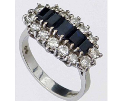 18ct (750) white gold sapphire and diamond ring, London 1978, of five baguettes surrounded by fourteen round brilliants, ring