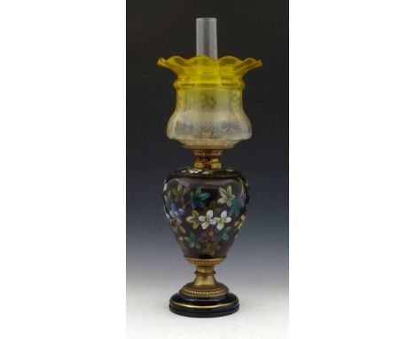 Victorian floral pottery oil lamp, height to burner 37cm, with yellow glass shade. Condition report: see terms and conditions