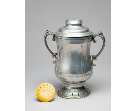 A rare Huntley & Palmer's biscuit tin designed as the FA Cup trophy and issued in 1927 in anticipation of Reading FC reaching