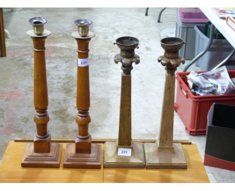 A pair of lamp bases and a pair of candlesticks