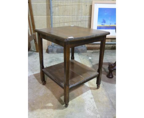 A small square occasional table with shelf under