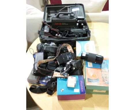 Two Pentax SLR cameras together with various lenses and accessories and an M3 VHS recorder
