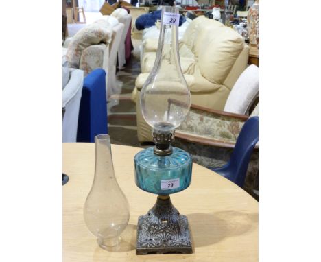 A 19th century oil lamp with blue glass resevoir