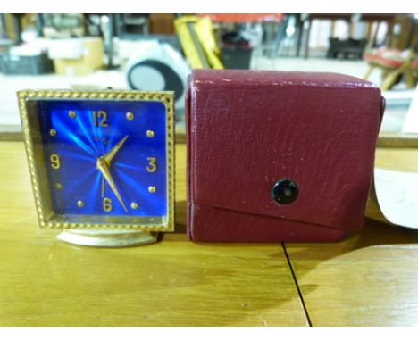 A cased Imhof travelling clock with blue enamel dial