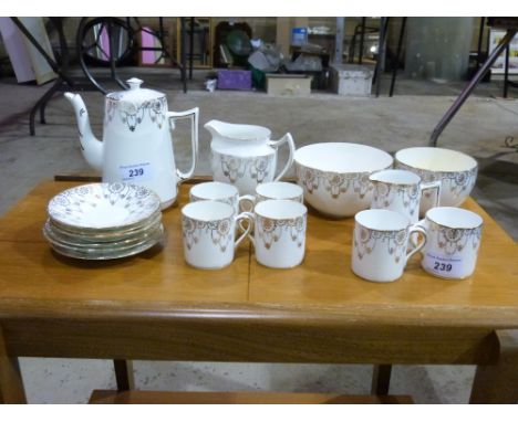 A gilt ceramic coffee service
