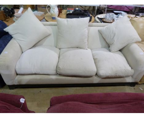 A white three seater sofa