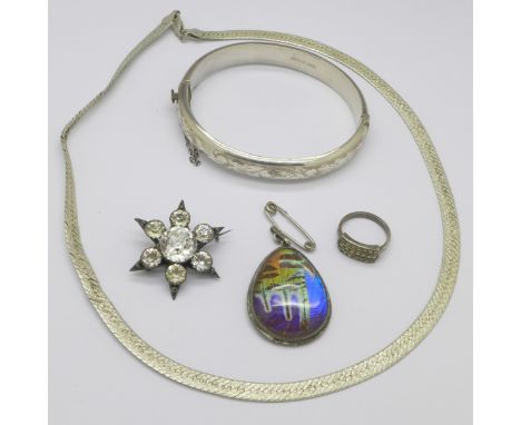 A Victorian silver paste set sunburst brooch, Birmingham 1896, a silver bangle, a .925 silver butterfly wing pendant, a .925 