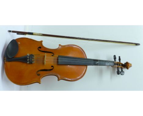 A Chinese violin with bow, in hard case, violin marked Skylark, length of back without button 34.25cm
