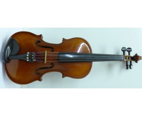 A Stradivarius copy violin in hard case, length of back without button, 35.5cm