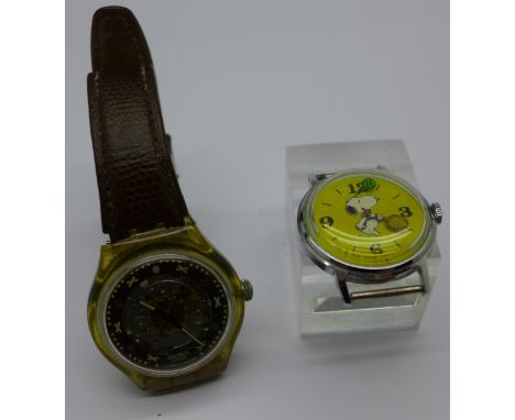 A Snoopy wristwatch head and a Swatch watch