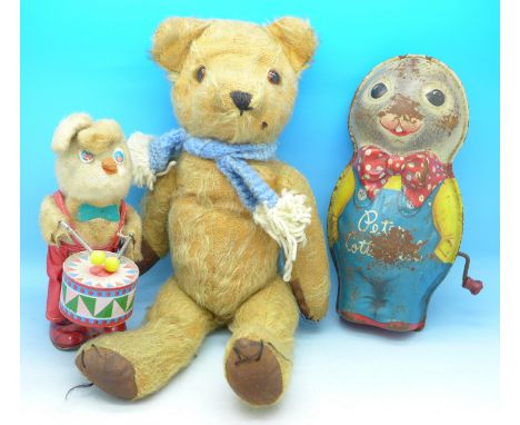 A Japanese clockwork drum playing rabbit, a small Teddy and a Mattel Peter Cottontail musical tin plate figure, a/f