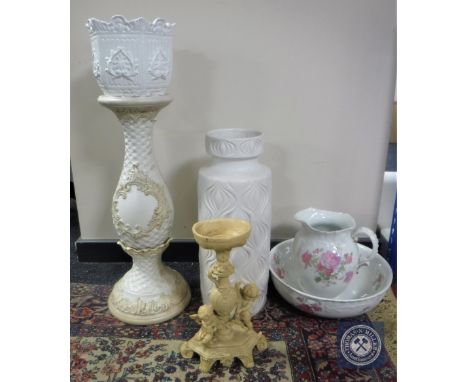 A West German cream pottery vase together with a Limoges wash jug and basin decorated with pink roses, a jardiniere on stand 