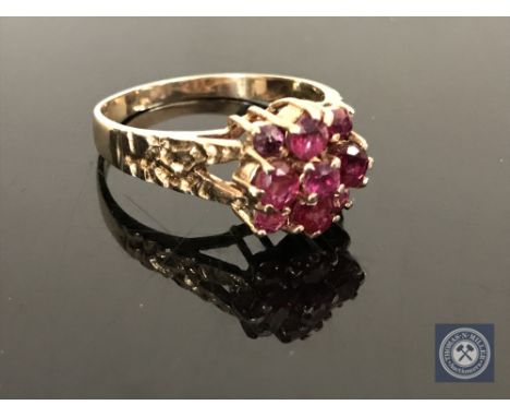 A 9ct gold ruby and diamond cluster ring, size O CONDITION REPORT: 2.8g