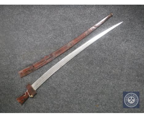 A late 19th/early 20th century Sudanese Kaskara sword in scabbard