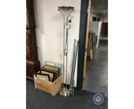 A chrome up-lighter and a projector screen 