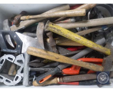 A crate of hand tools and hammers 