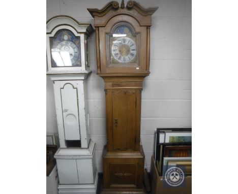 A continental oak longcase clock with later brass moon phase dial, with pendulum and weights 
