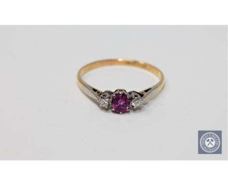 An 18ct gold ruby and diamond ring