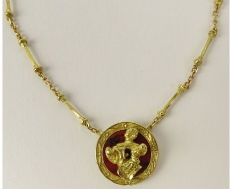 Salvador Dalí, Spanish (1904-1989) 18K Yellow Gold and Carnelian Figural Pendant on Hand Made Chain. "Madonna De Port Lligat"