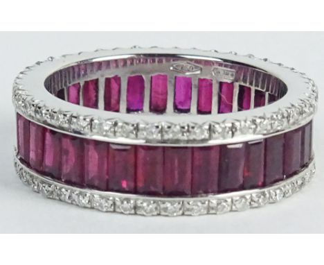 Lady's Circa 1930's Invisible Set Ruby, Diamond and 18 Karat Eternity Band. Rubies with Vivid Saturation of Color. Signed 750