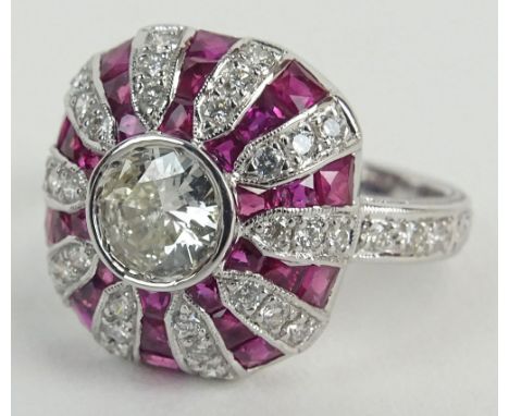 Lady's Diamond, Ruby and 18 Karat White Gold Ring set in the center with a .54 Carat Round Cut Diamond. Diamonds F-G-H Color,