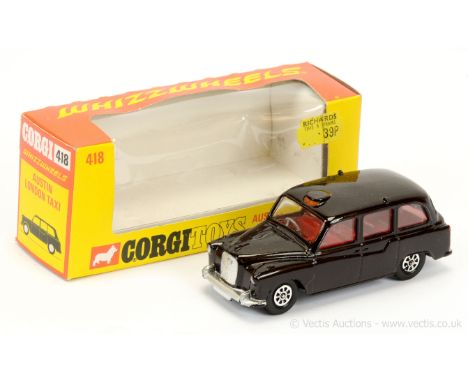 Corgi 418 Whizzwheels Austin "London Taxi" - black body, red interior with grey steering wheel, silver trim - Near Mint (coup