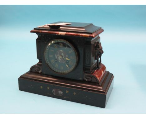 A Victorian black slate mantel clock, with rouge marble mouldings, lion-mask ring handles, French movement striking on a bell