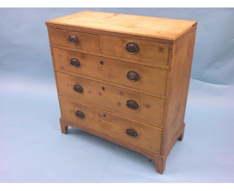 An early Victorian stripped pine chest, two short and three long graduated drawers, replacement oval pressed brass handles, b
