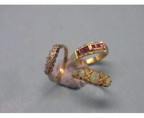 An 18ct. gold ring, angular design set diamond chips and rubies, size L, an 18ct. gold and diamond half-hoop ring, and an 18c