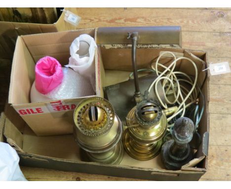 A serpentine 'lighthouse' table lamp, pair of brass oil lamps, one with shade, both with chimneys, and a brass desk-lamp