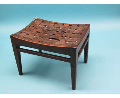 An oak stool, Arthur W. Simpson, The Handicrafts, Kendal, woven leather seat with sheet-iron studs, maker's label attached 