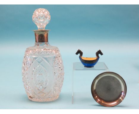 A cut glass decanter, with stopper and silver mount, Mappin & Webb, London 1938, 10.5in. together with a small engine-turned 