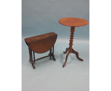 A Victorian mahogany wine table, circular top on turned tripod base, 1ft. 6in., and a Victorian walnut Sutherland table, turn