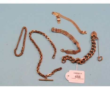 An engraved 9ct. gold hollow-link bracelet, 18.6 grams, 9ct. gold-link bracelet, 9.9 grams, a yellow metal watch-chain with T